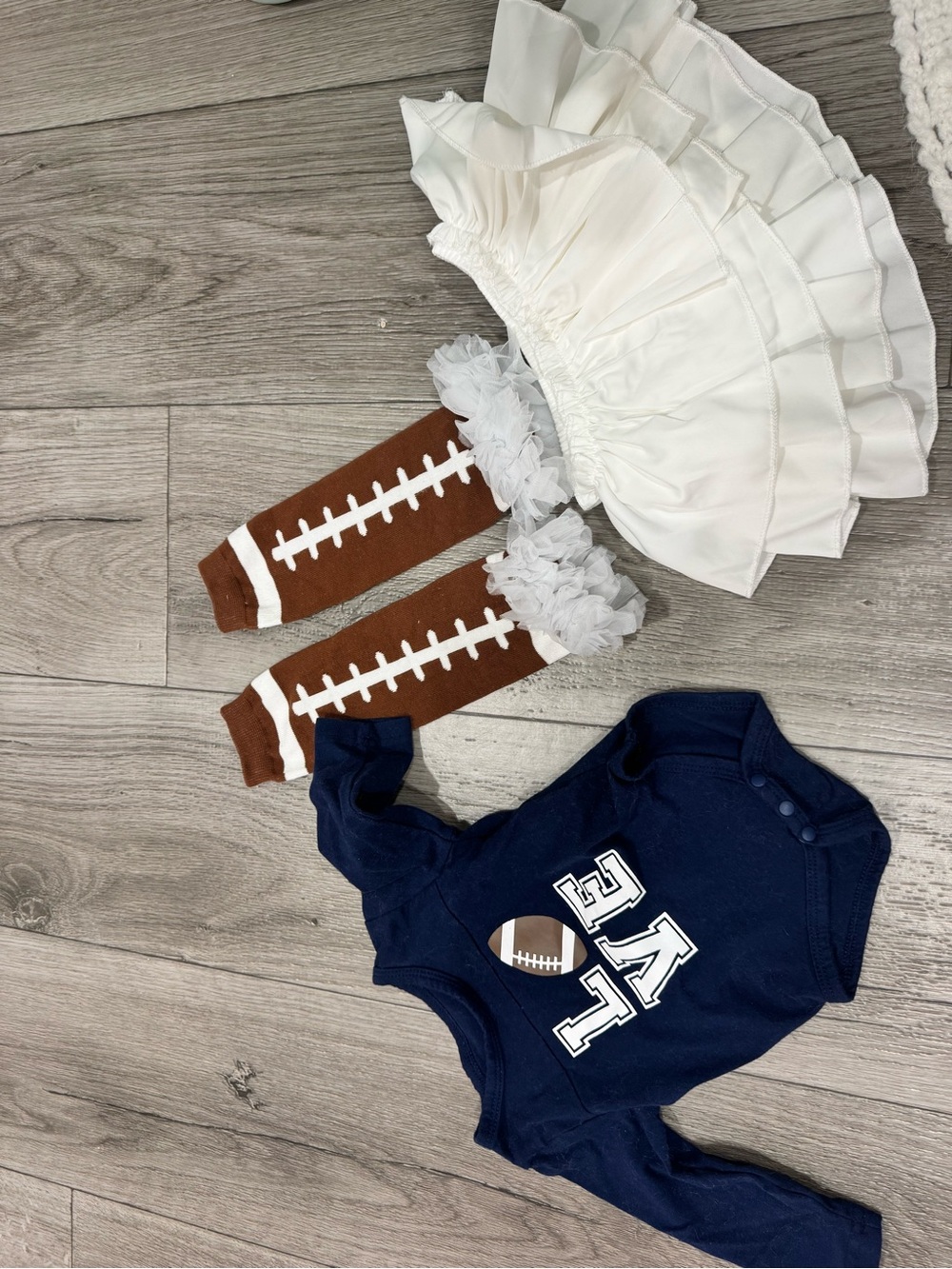 Navy Baby Football Bodysuit with White Ruffle Skirt & Brown Football Leg Warmers